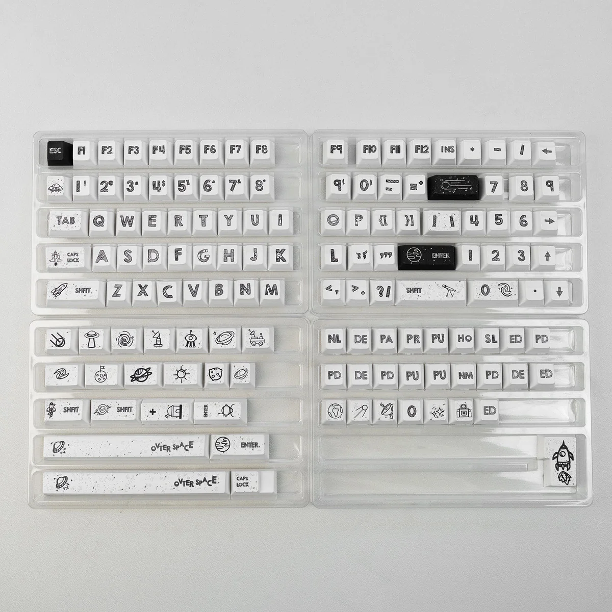 Explore different angles of the durable 131-key Astronaut PBT keycap set, showcasing crisp dye-sublimated space legends on a clean white base.
