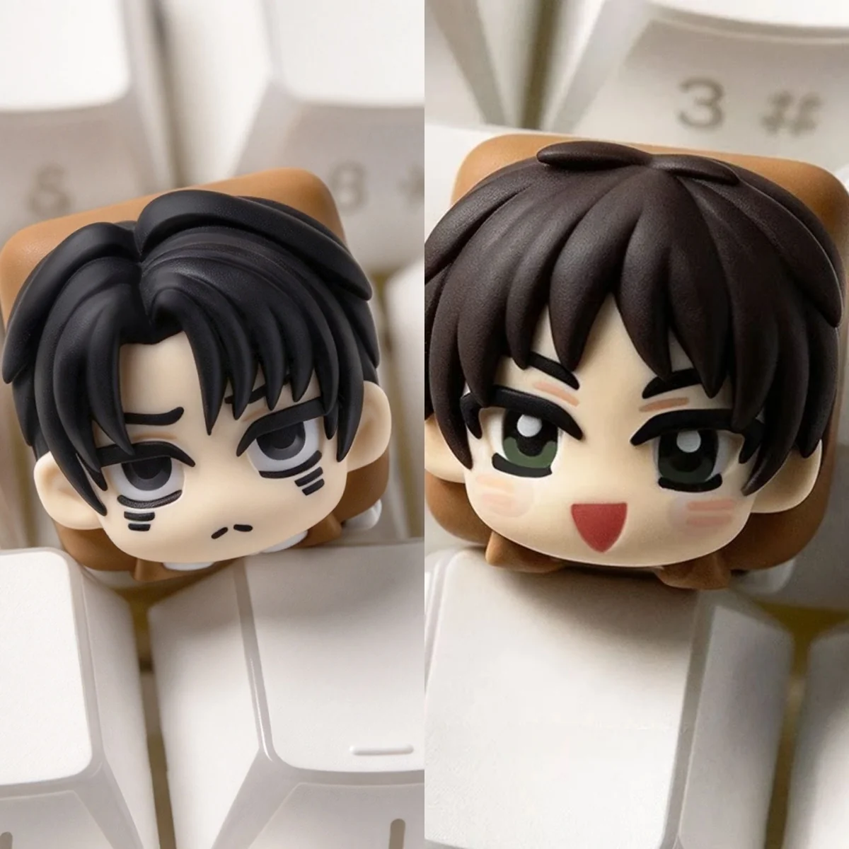 Playful hand-sculpted chibi Eren and Levi Attack on Titan keycap with glossy resin 3D anime heads on a white keyboard.
