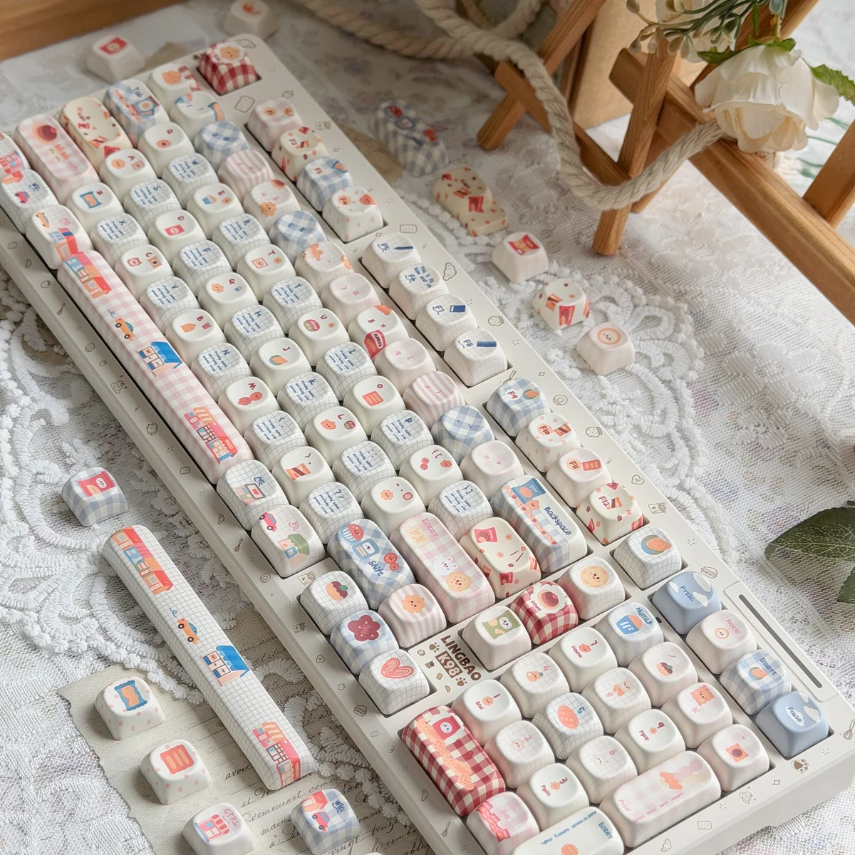A close-up view of the Whimsical Biscuit Diary PBT MOA Keycap Set, showcasing adorable biscuit and cookie designs on creamy PBT, exuding a cozy.