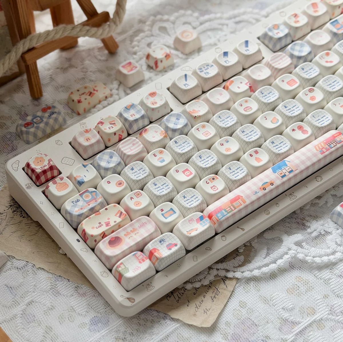 A charming close-up of Whimsical Biscuit Diary PBT MOA Keycaps, revealing delightful biscuit and cookie motifs on creamy PBT, evoking a cozy.