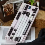 Ceramic Keycap Set Black Veil Pink Dimple. Exquisite ceramic keycaps, multi-angles highlight mysterious dark and pink tones, offering tactile visual luxury.