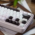Artisan Ceramic Keycap Set Black Veil Pink Dimple. Smooth ceramic, dark and pink accents. Various views emphasize its luxurious feel and look.