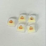 Close-up of charming, handcrafted translucent Capybara Couple Lulu XDA keycaps, showcasing their playful glow from various angles on a custom keyboard setup.