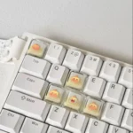 Playful, handcrafted translucent Capybara Couple Lulu XDA keycaps charmingly illuminating a custom keyboard setup. A delightful 5-piece set.