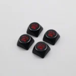 Angled view of the artistic aluminum cat paw keycaps, showcasing their vibrant electroplated finish and premium metal craftsmanship.
