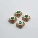 Premium artistic aluminum cat paw arrow keycaps, electroplated with vibrant colors and a sleek metallic finish, shown from distinct angles.