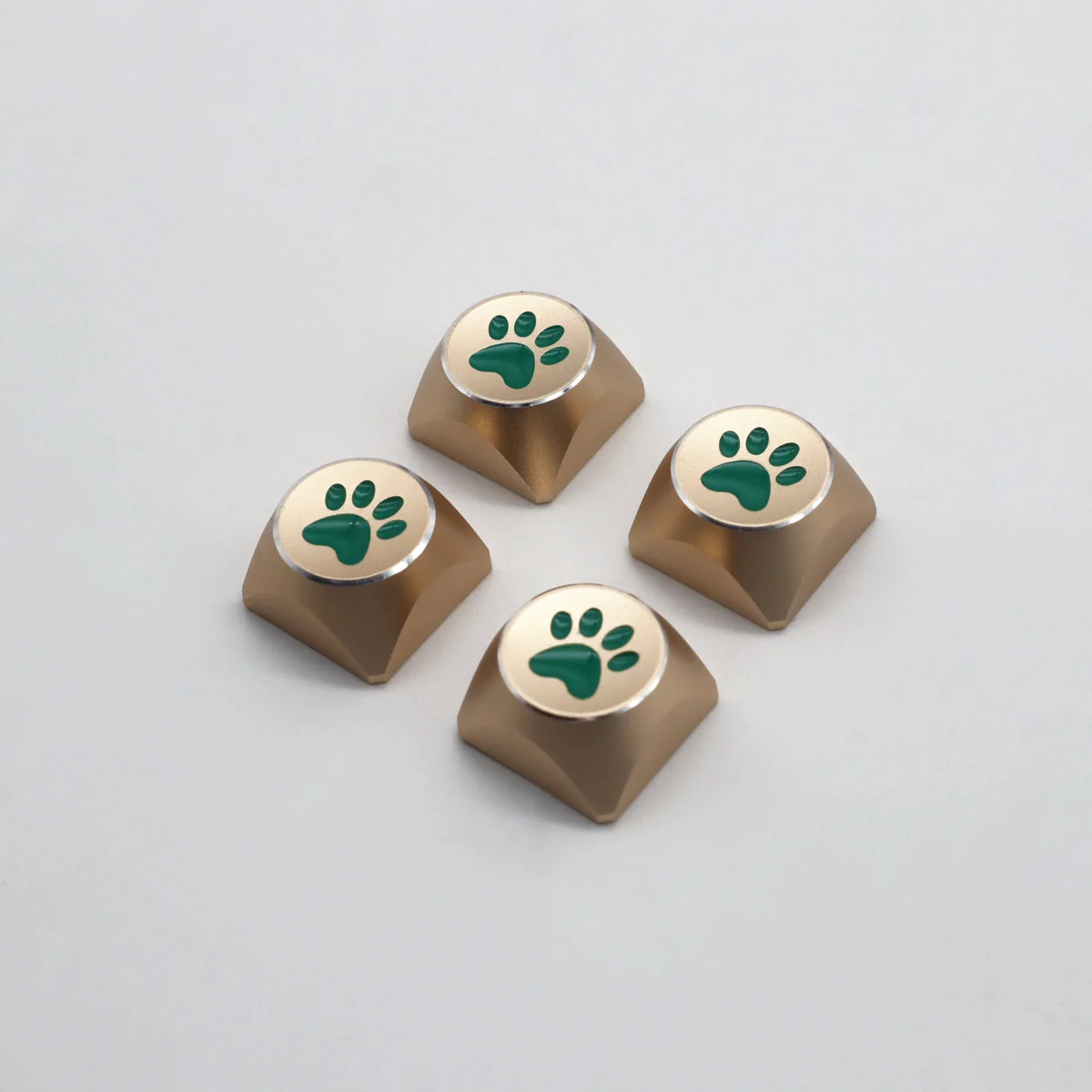 Premium artistic aluminum cat paw arrow keycaps, electroplated with vibrant colors and a sleek metallic finish, shown from distinct angles.