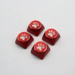 Vibrant electroplated aluminum cat paw arrow keycaps, presented from various angles to highlight their premium metal design and whimsical charm.