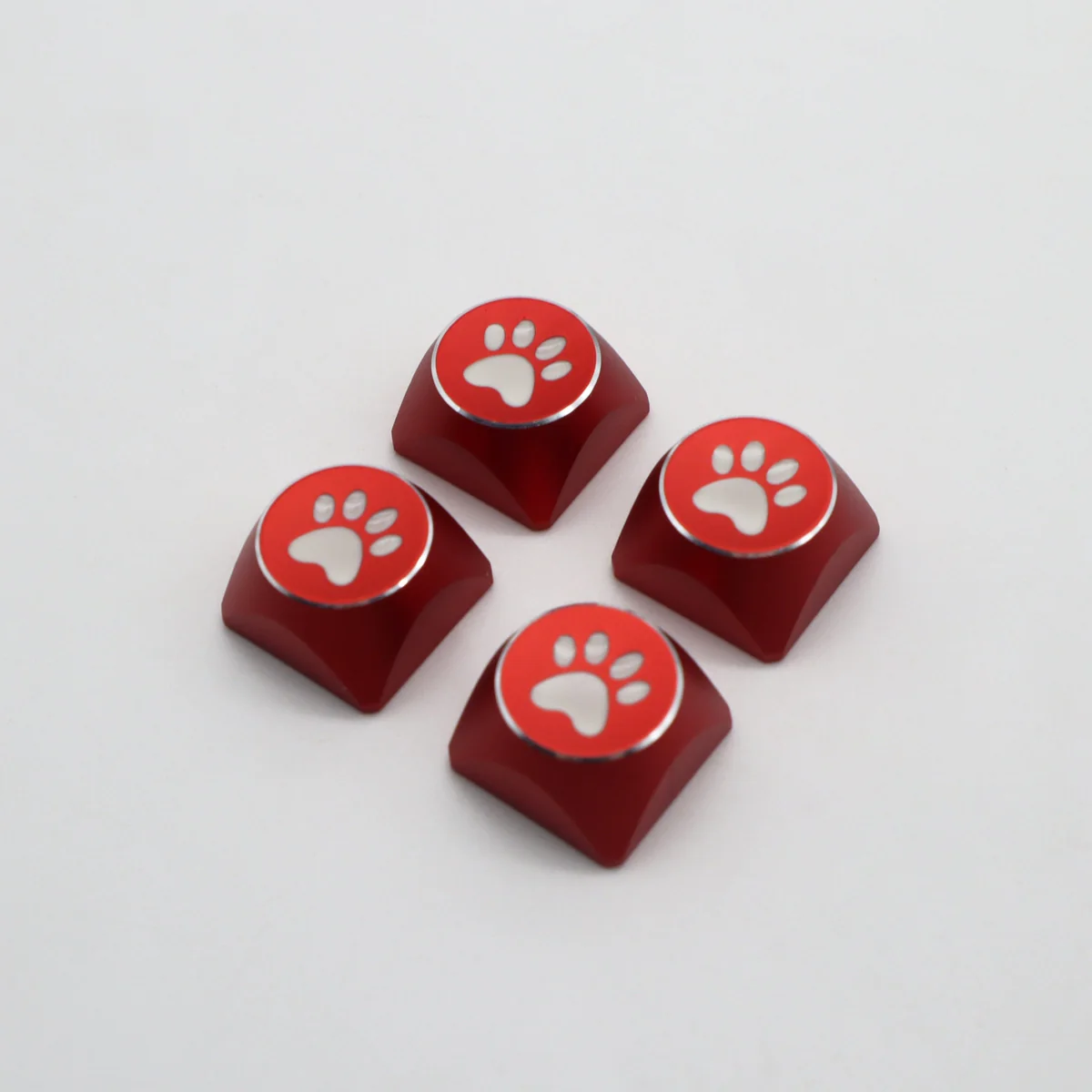 Vibrant electroplated aluminum cat paw arrow keycaps, presented from various angles to highlight their premium metal design and whimsical charm.