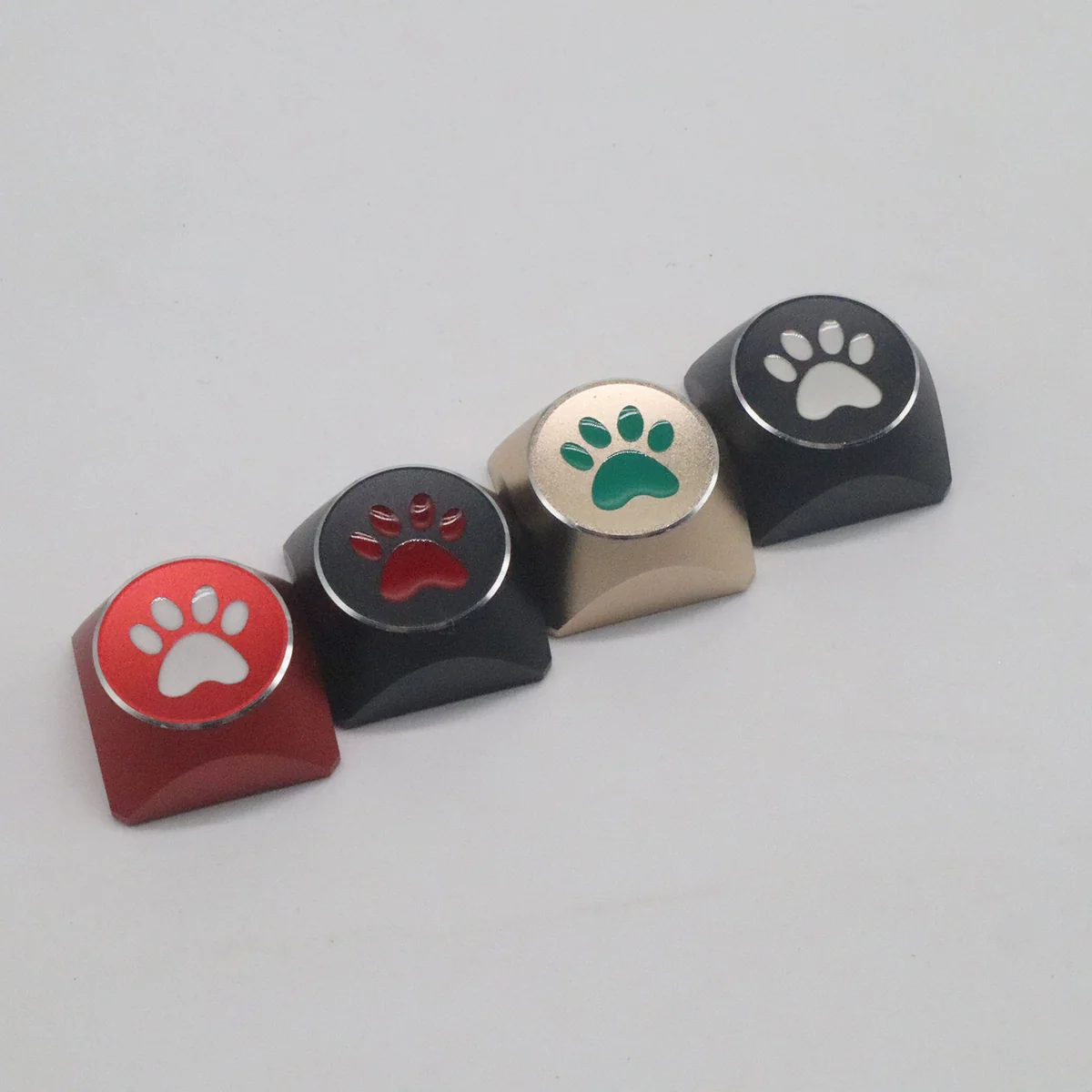 Artistic electroplated aluminum cat paw arrow keycaps, featuring a vibrant, premium metal design for a whimsical keyboard upgrade.