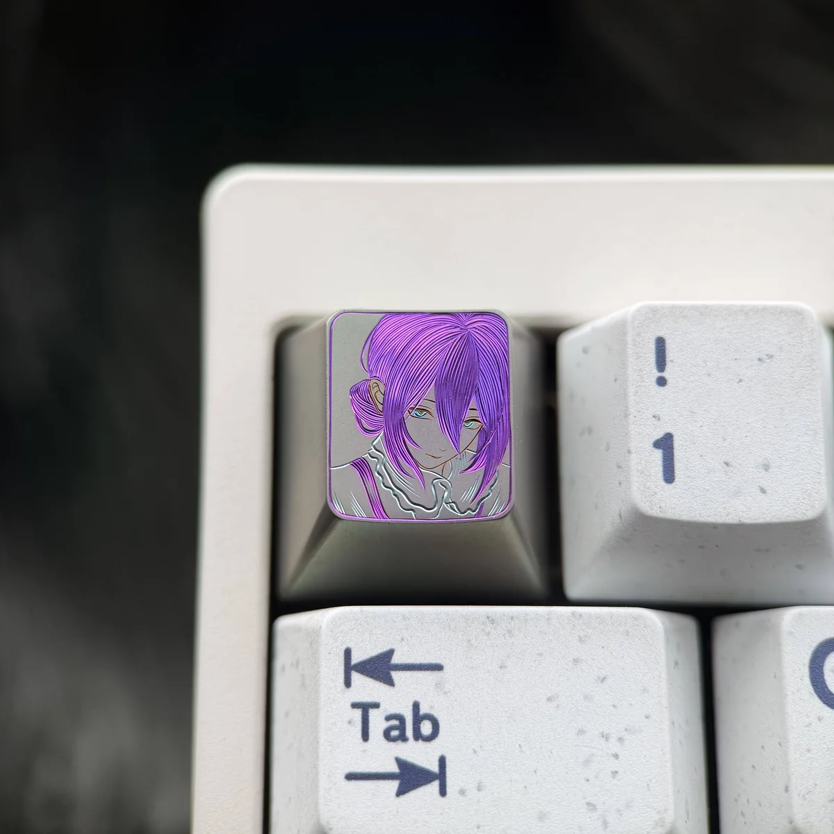 Hand-carved titanium Chainsaw Man Reze keycap, showcasing vibrant colored lines in Theme One, an artisan collectible.