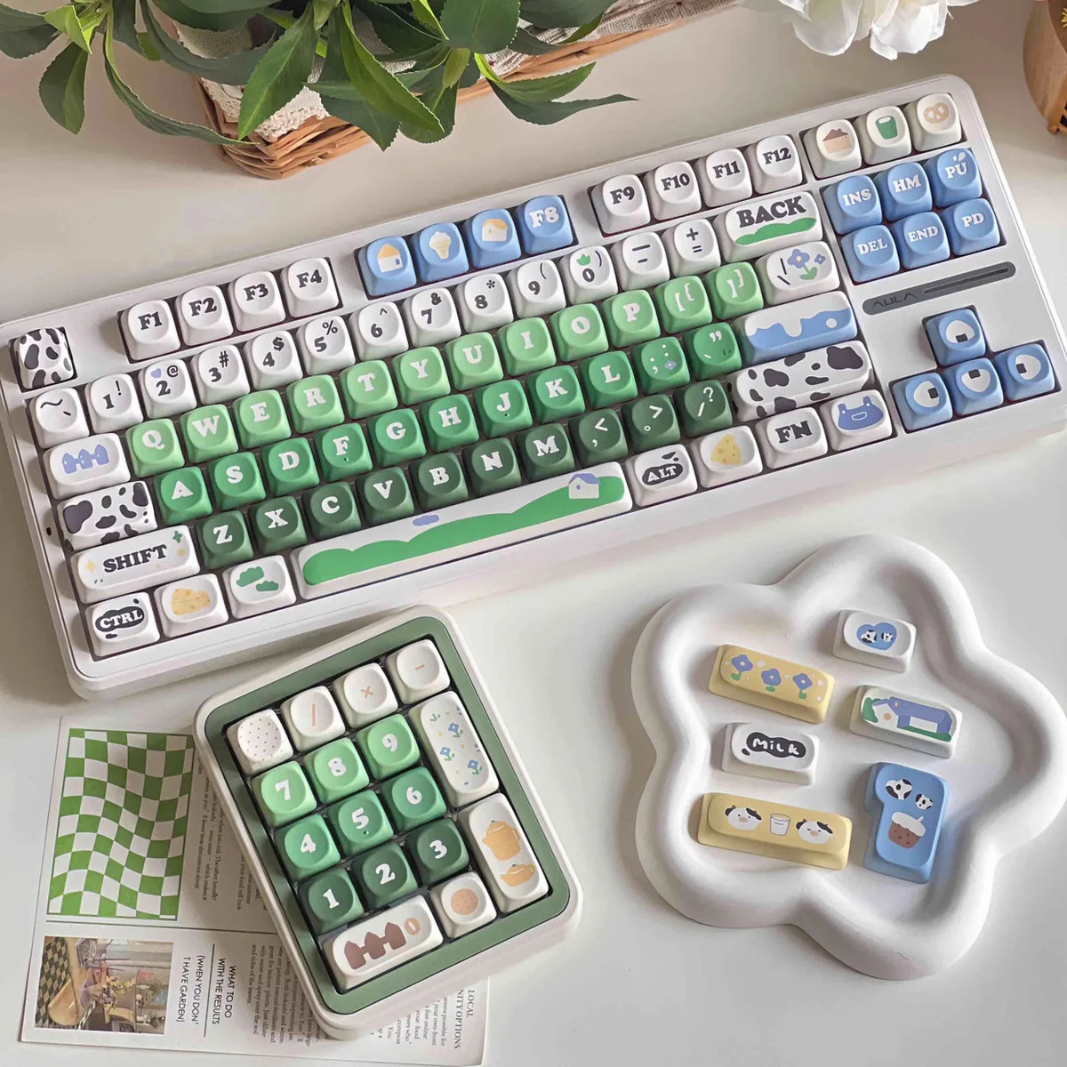 Cow Pasture keycaps MOA PBT dye-sub set with cream cows, green meadows, blue sky, and milk accents on a playful keyboard.
