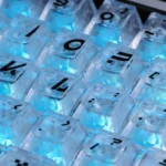 Premium CSGO Printstream Carbon Fiber Keycap Set showcasing intricate carbon fiber texture and vibrant shine-through CS:GO skin graphics from a dynamic angle.