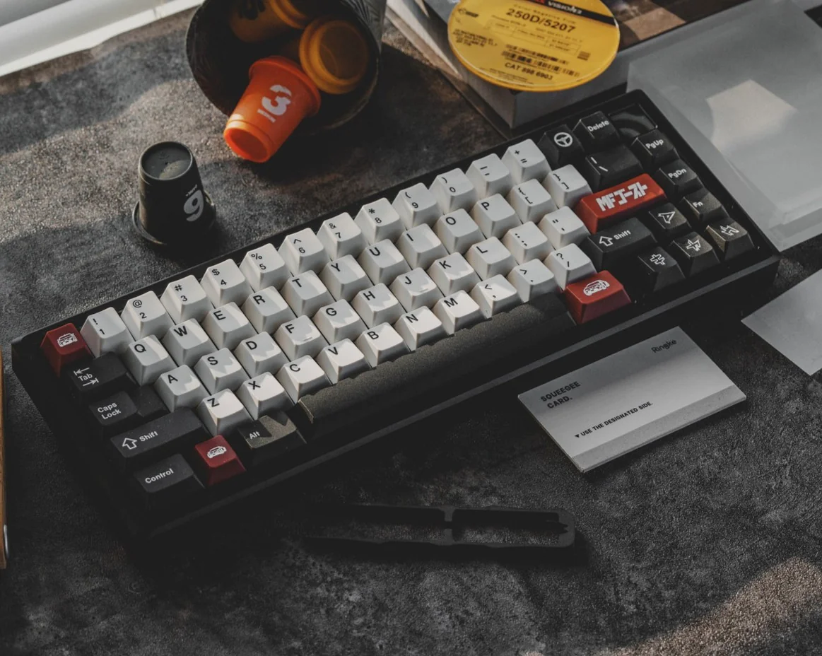 Drift keycap set featuring JDM drift racing aesthetic with white alphas, black modifiers, and red car novelty keys in ABS double-shot.