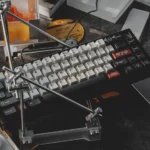 The Drift keycap set is shown on a mechanical keyboard with JDM drift racing style, white alphas, black modifiers, and red car novelties.