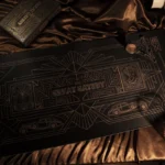 Gatsby Desk Mat: luxurious Art Deco golden dream, shown from a distinct angle. Opulent 1920s patterns transform your workspace.
