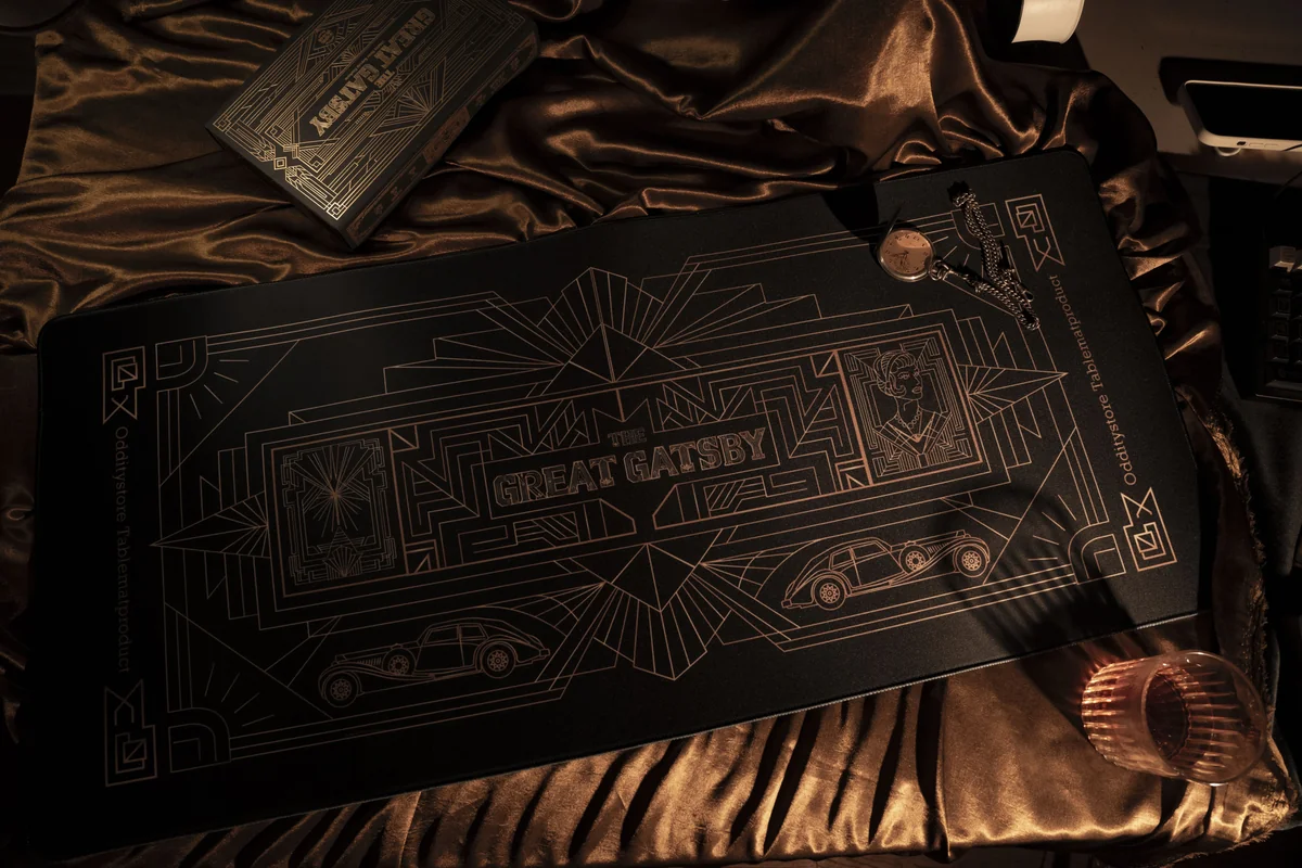 Gatsby Desk Mat: luxurious Art Deco golden dream, shown from a distinct angle. Opulent 1920s patterns transform your workspace.