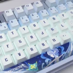 Dynamic views of premium Genshin Impact Anastasya PBT translucent keycaps, highlighting their ethereal icy blue and white aesthetic.