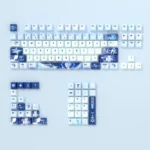 A detailed view of premium Genshin Impact Anastasya PBT translucent keycaps, highlighting their ethereal icy blue and white aesthetic from multiple angles.