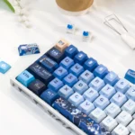 Elegant Furina Hydro Archon PBT Dye-Sub Keycap Set shown from various angles, highlighting vibrant Genshin Impact artistry.