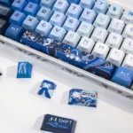 Elegant Furina Hydro Archon PBT Dye-Sub Keycap Set. Close-up views reveal vibrant Genshin Impact artistry and exclusive fan-inspired designs.