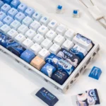 Detailed view of the exclusive Furina Hydro Archon PBT Dye-Sub Keycap Set, highlighting the exquisite fan-inspired Genshin Impact designs from a unique angle.