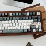 Green House PBT Dye-Sub Wizardry Keycaps Set, detailed view of green and silver designs from a side angle.