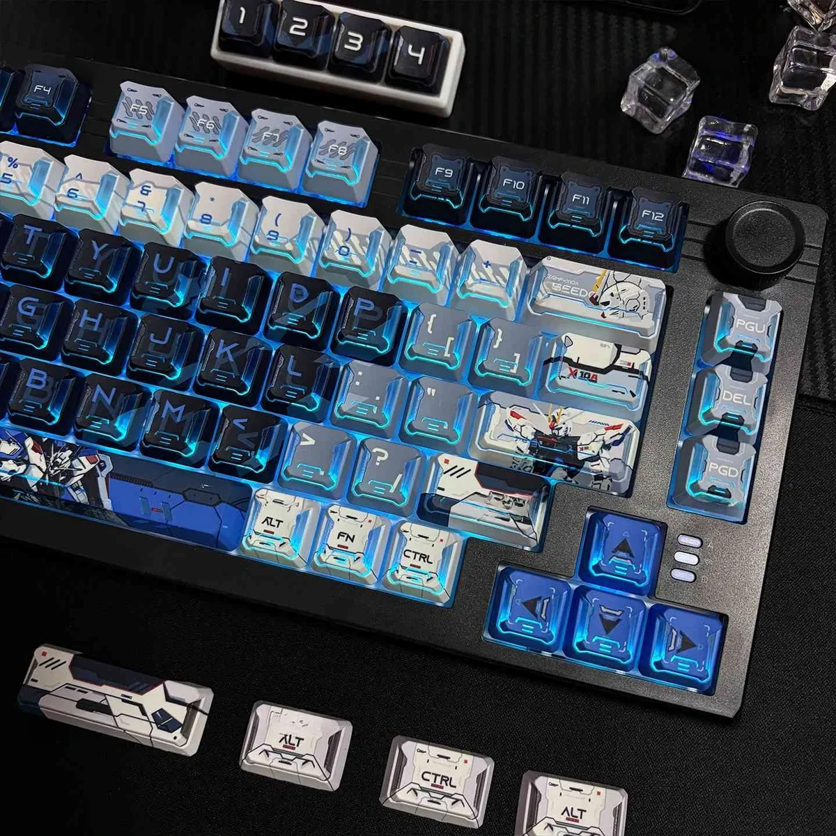 A gallery of Freedom Gundam PBT mecha keycaps, displaying their dynamic futuristic design and intricate robotic details from multiple angles.