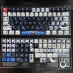 PBT Freedom Gundam mecha keycap from multiple angles, showcasing its dynamic futuristic design and intricate robotic details with glowing accents.