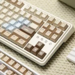 Adorable Hakimi PBT dye-sub keycap set for custom keyboards. Gallery shows playful soft-hued designs, durable sweet cuteness.