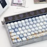 A collection of exquisite hand-painted whimsical blue keycap set images, showcasing detailed dandelion and fox art from multiple angles.