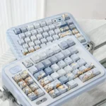 Exquisite hand-painted blue keycap set, showcasing whimsical dandelion and fox art in dreamy blue hues. Brings artistic fantasy to your desk.