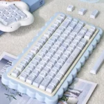 Explore the adorable PBT MOA Healing Bear keycaps set, featuring charming pastel bears and comforting elements arranged for a whimsical and serene design.