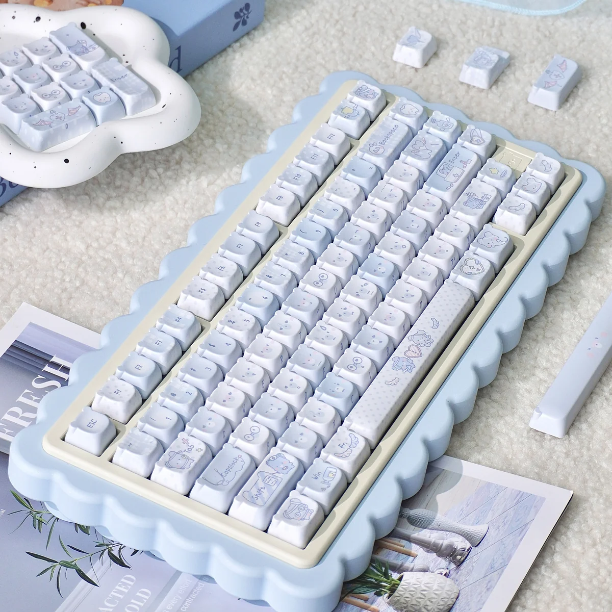 Explore the adorable PBT MOA Healing Bear keycaps set, featuring charming pastel bears and comforting elements arranged for a whimsical and serene design.