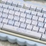 Adorable PBT MOA Healing Bear keycaps in a charming small full set, featuring pastel shades for a serene and whimsical desktop.