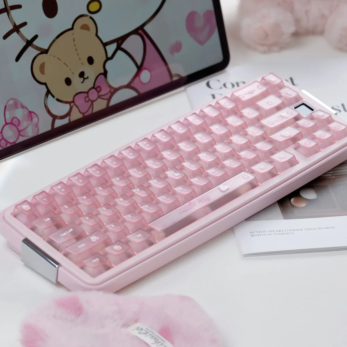 Frosted Pink full PC Hello Kitty keycap set on a pastel keyboard, with glossy candy-like translucent keys and cute motifs in a playful setup.