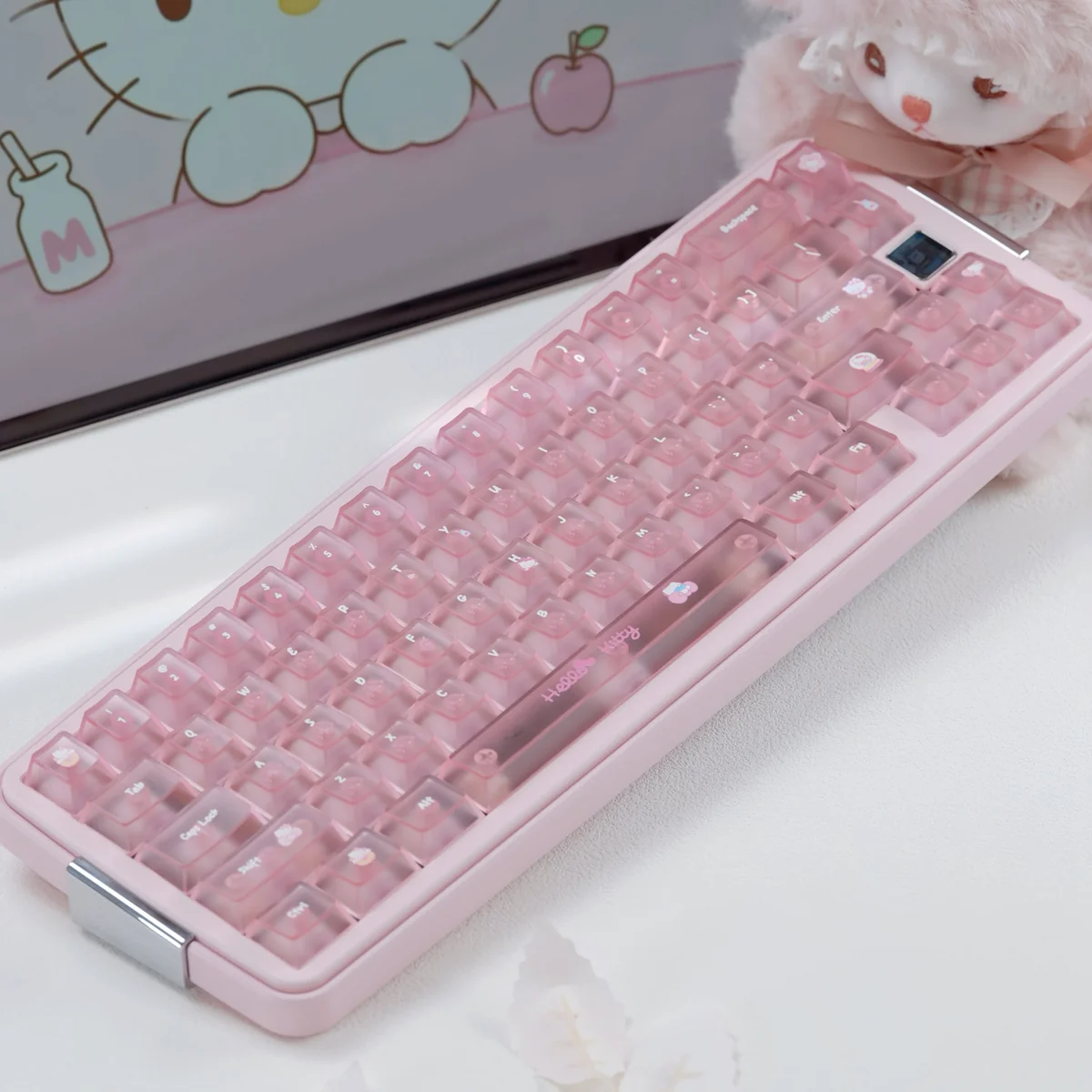 Hello Kitty keycaps in a Frosted Pink PC full keycap set with glossy candy-like keys and cute motifs on a pastel keyboard.