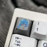 Hand-carved titanium Hoshimachi Suisei VTuber keycap, shown from multiple angles. Features vibrant anime design and intricate details on premium alloy.