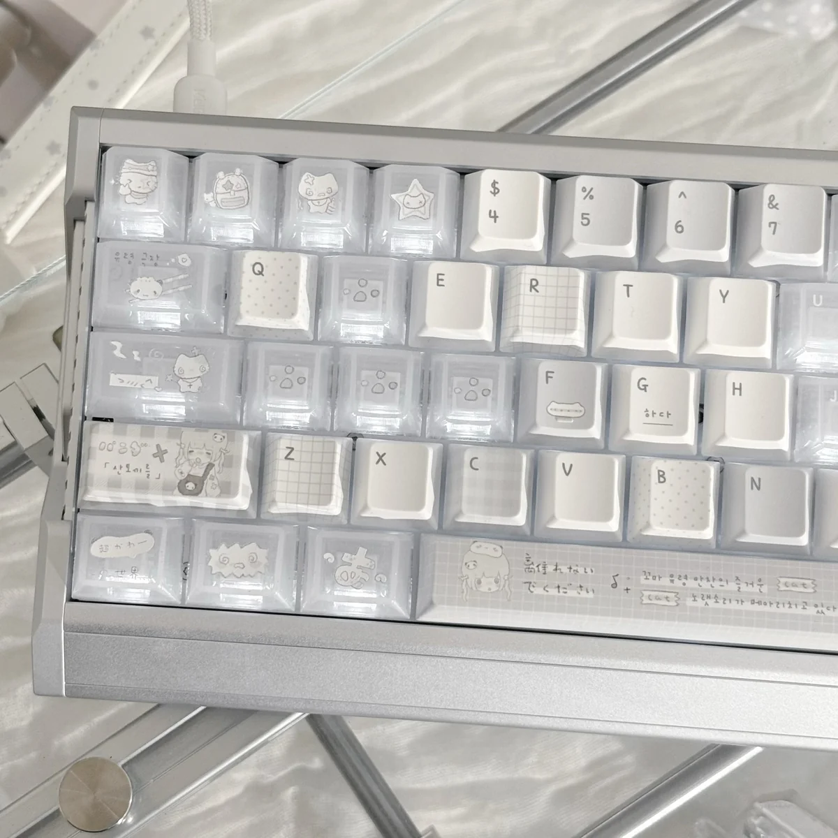 Serene muted grey PBT Insomnia keycaps, showcasing the minimalist backlit design from various angles. The soft translucent glow creates a contemplative aesthetic.