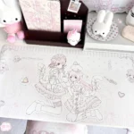This oversized waterproof kawaii anime desk mat features pastel pink lolita cat-girl line art, ribbons, hearts, polka dots, and a non-slip PU surface.