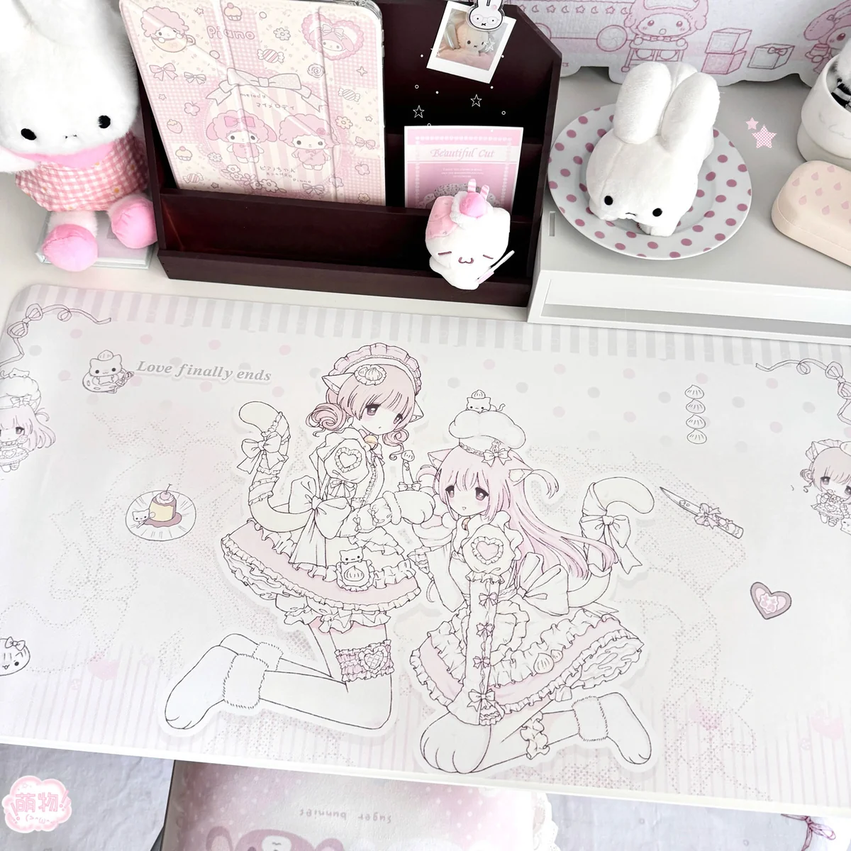 This oversized waterproof kawaii anime desk mat features pastel pink lolita cat-girl line art, ribbons, hearts, polka dots, and a non-slip PU surface.