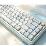 Close-up of serene grey-blue Korean MOA PBT keycaps set, showcasing their unique rounded profile and crisp Korean legends for elegant typing from multiple angles.