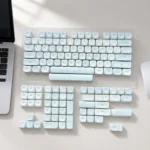 Serene grey-blue Korean MOA PBT keycaps set. Showcases unique rounded MOA profile and crisp Korean legends, embodying minimalist elegance for premium typing experience.