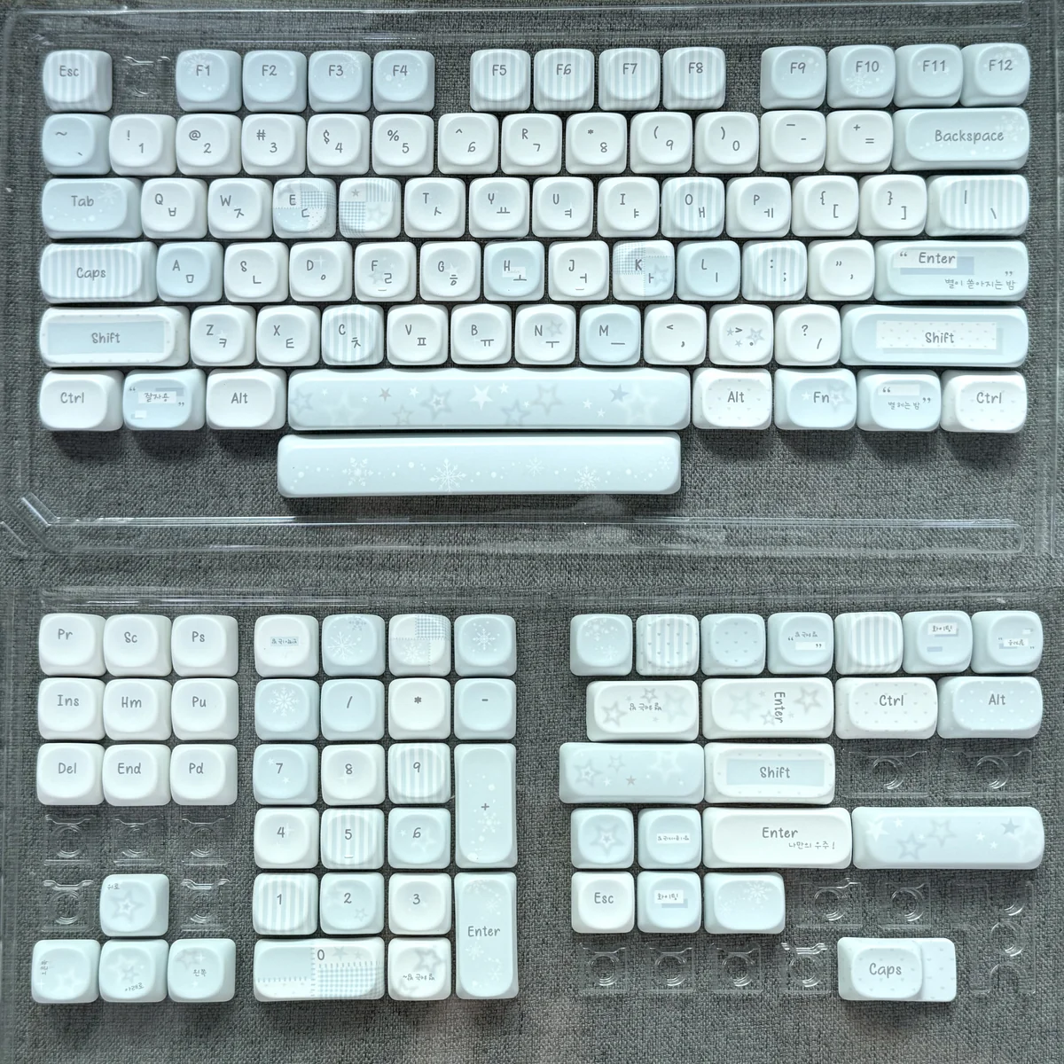 Close-up of serene grey-blue Korean MOA PBT keycap set, showcasing the unique rounded profile and crisp Korean legends, perfect for elegant custom keyboard.
