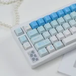 Whimsical blue and white Leisure Rabbit PBT Keycaps, a durable PBT full set. Serene rabbit motifs and artistic design create a tranquil desktop aesthetic.