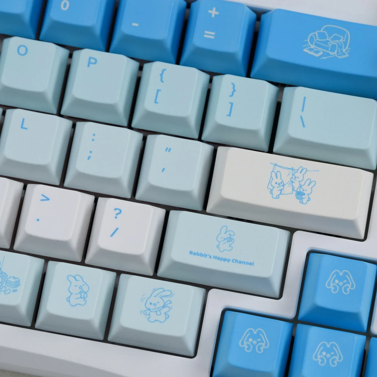 Artistic product images of Leisure Rabbit PBT keycaps, showcasing the full whimsical blue and white rabbit motifs from various angles.