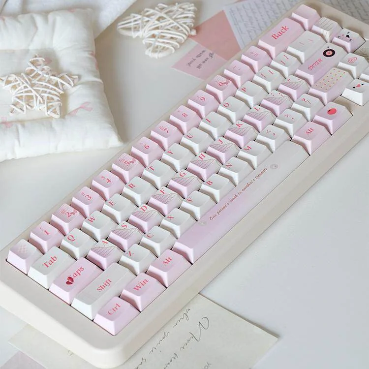 Love Diary PBT keycaps, artfully arranged to showcase their unique profile, thick PBT, warm muted colors, and charming vintage stationery.