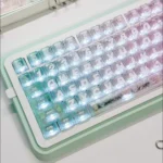 Close-up of the unique Mint Carbon Fiber Transparent PC keycap for MX keyboards, showcasing its cool mint tones and intricate carbon patterns.