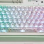 Mint carbon fiber transparent PC keycap for MX keyboards, showcasing its unique intricate pattern, cool mint tones, and translucent base.