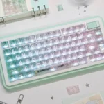 A unique mint carbon fiber transparent PC keycap for MX keyboards, showcasing cool mint tones and intricate patterns on a translucent base.